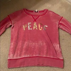 An American Eagle Red Peace Long Sleeve.